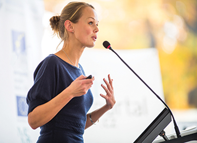 Woman speaking at a conference